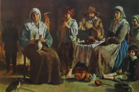 Francuscy malarze uchwycili scenę z życia wiejskiego: rodzina przy stole, dziecko gra na flecie, pies i koty.
