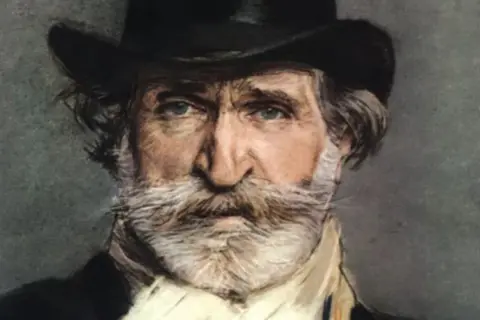 Portret mężczyzny z siwą brodą i wąsami, w cylindrze. To Giuseppe Verdi, słynny kompozytor.