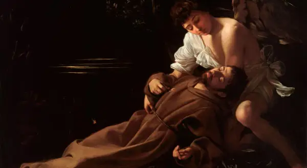 Anioł czuwa nad śpiącym świętym Franciszkiem. Caravaggio, mistrz światłocienia, ukazuje tu jeden ze swoich najsłynniejszych obrazów.