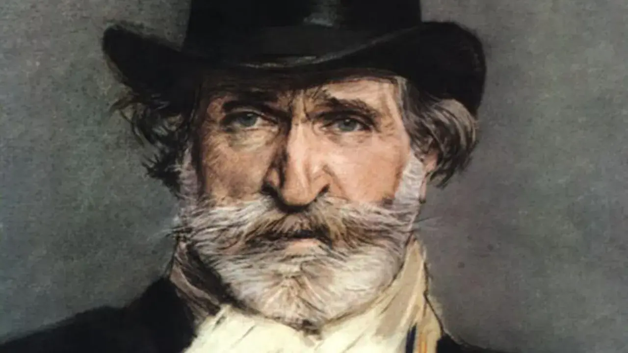 Portret mężczyzny z siwą brodą i wąsami, w cylindrze. To Giuseppe Verdi, słynny kompozytor.